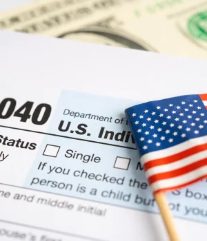 tax-return-form-1040-with-usa-america-flag-dollar-banknote-us-individual-income_39768-7080